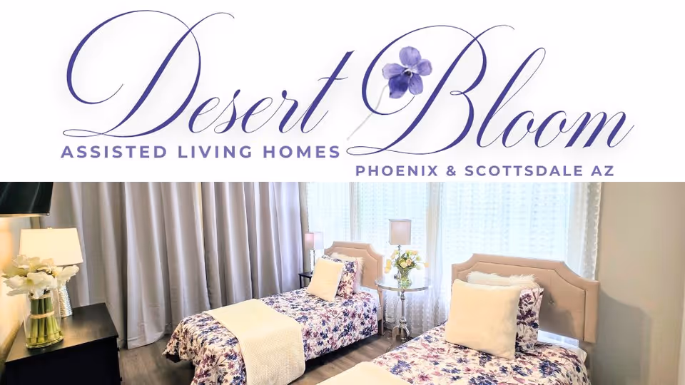 Two twin beds with floral quilts and lamps in a bright bedroom.