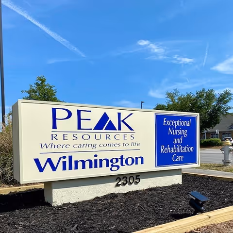 A large outdoor building sign for Peak Resources Wilmington with the address 2305.