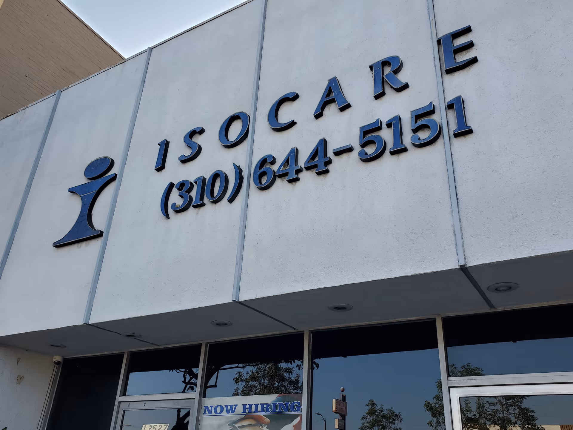 Exterior of Isocare Home Health building with large sign and windows