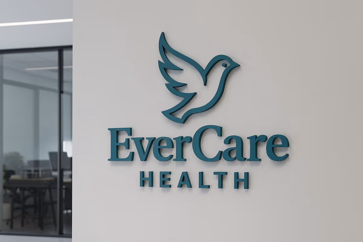 Exterior wall with EverCare Health sign and dove logo beside glass entrance.