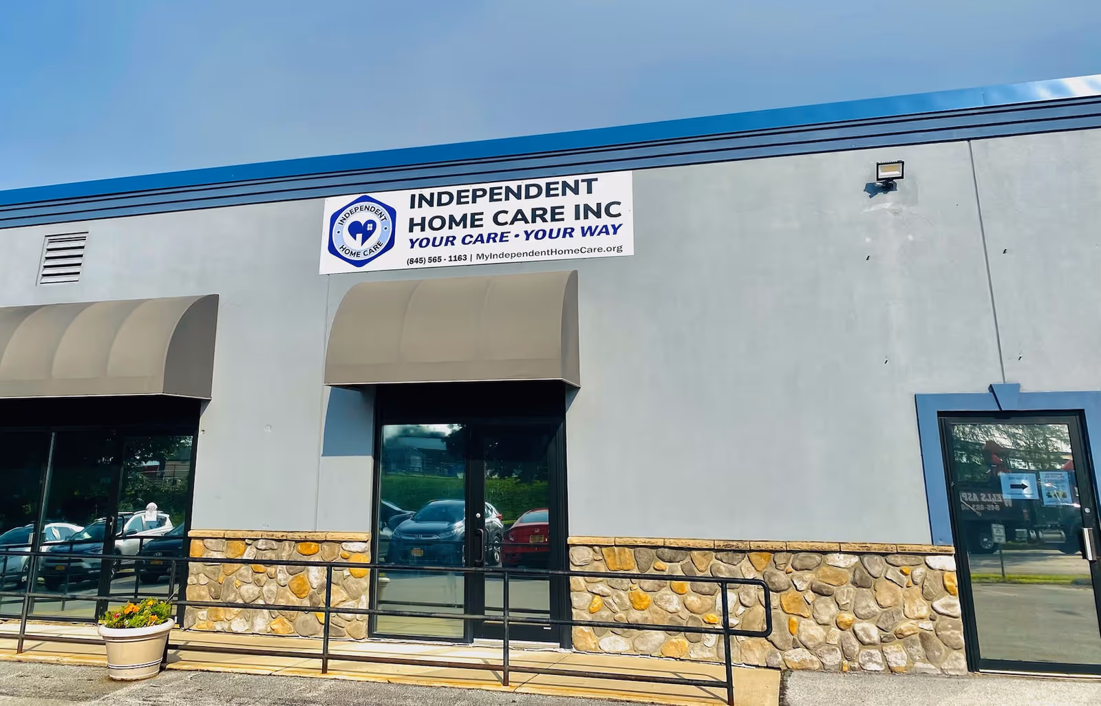 Front view of Independent Home Care, Inc. building with sign and entrance.