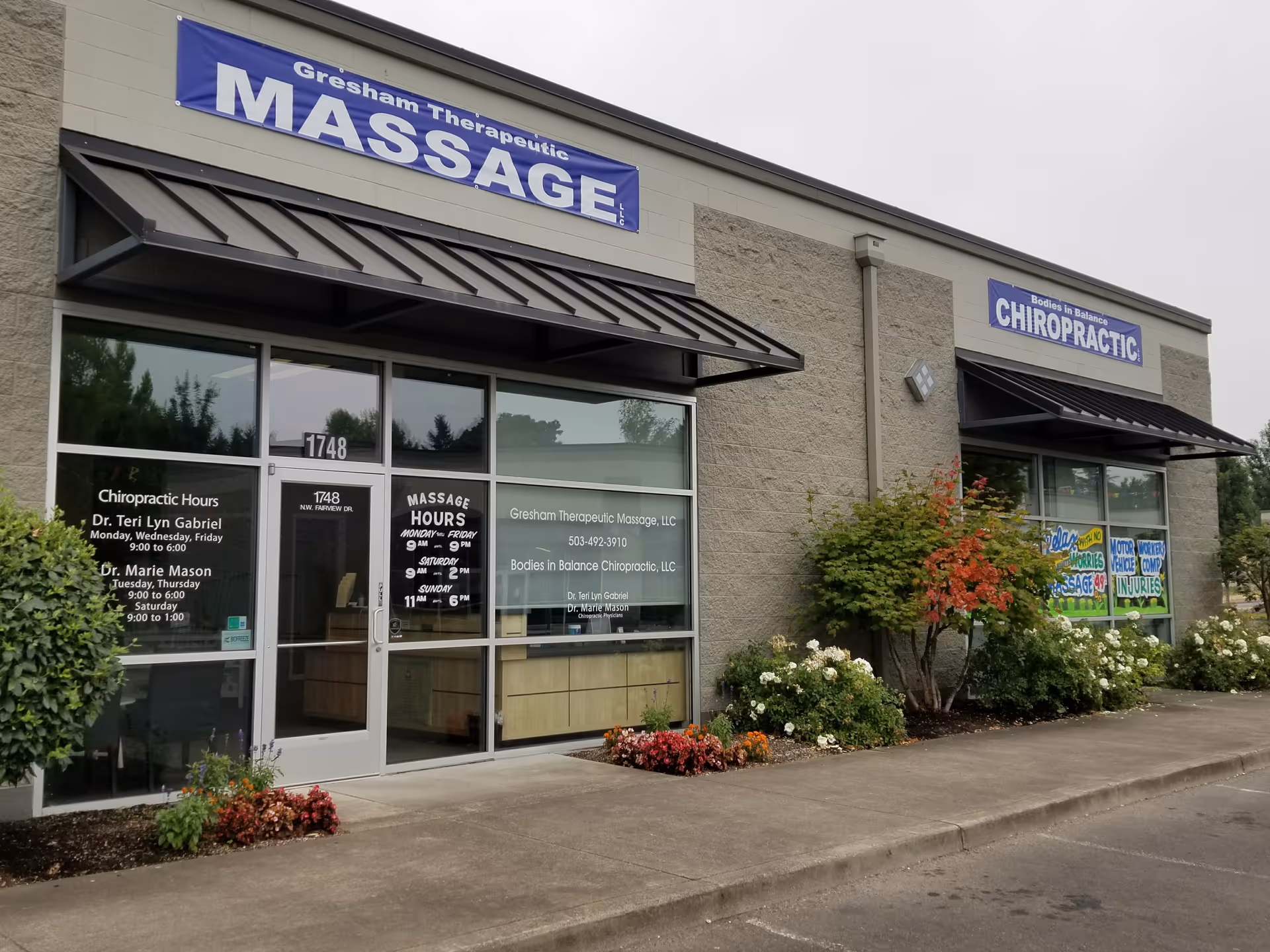 Gresham Therapeutic Massage Center storefront with massage and chiropractic signs.
