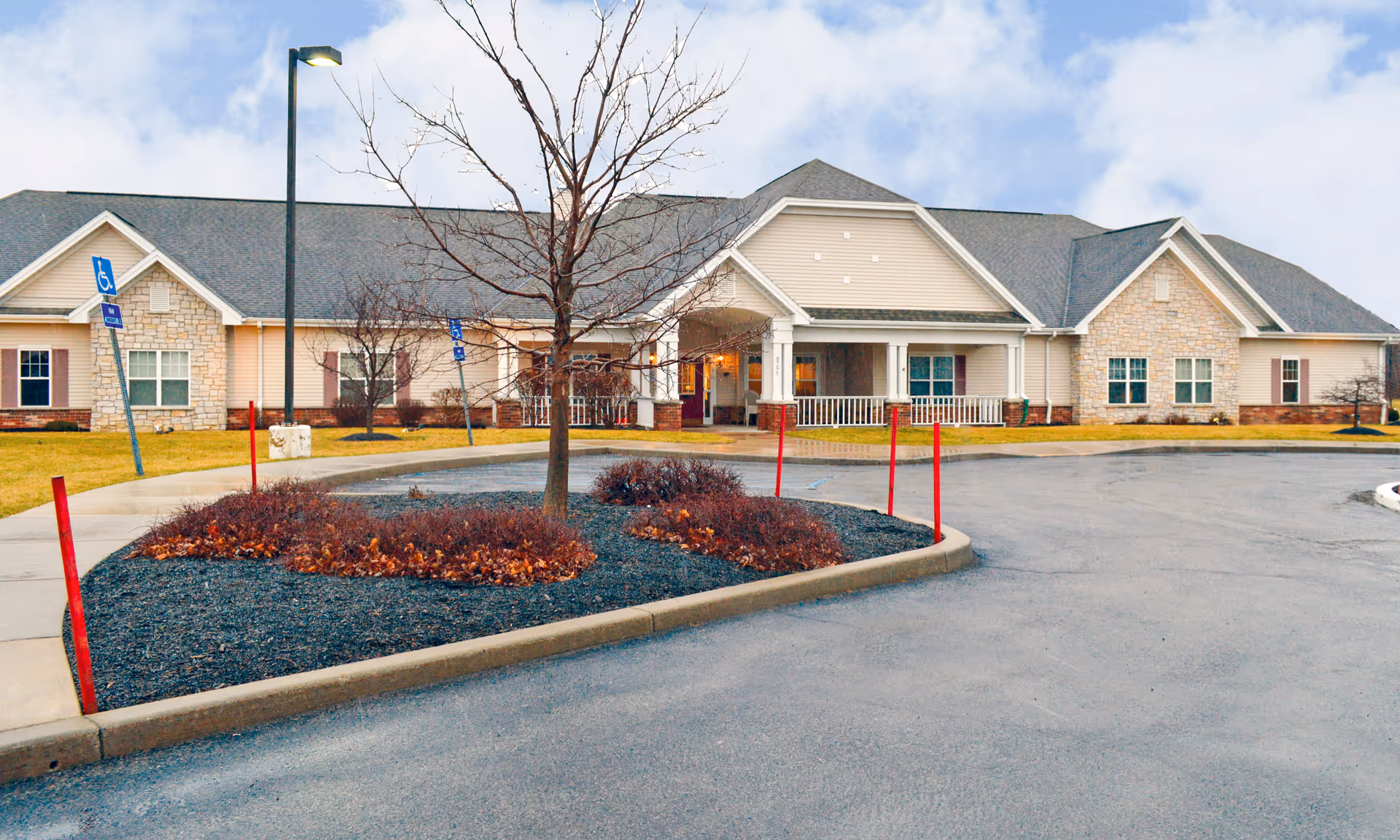 Exterior view of Brookdale Niagara building with entrance, driveway, and landscaped island.