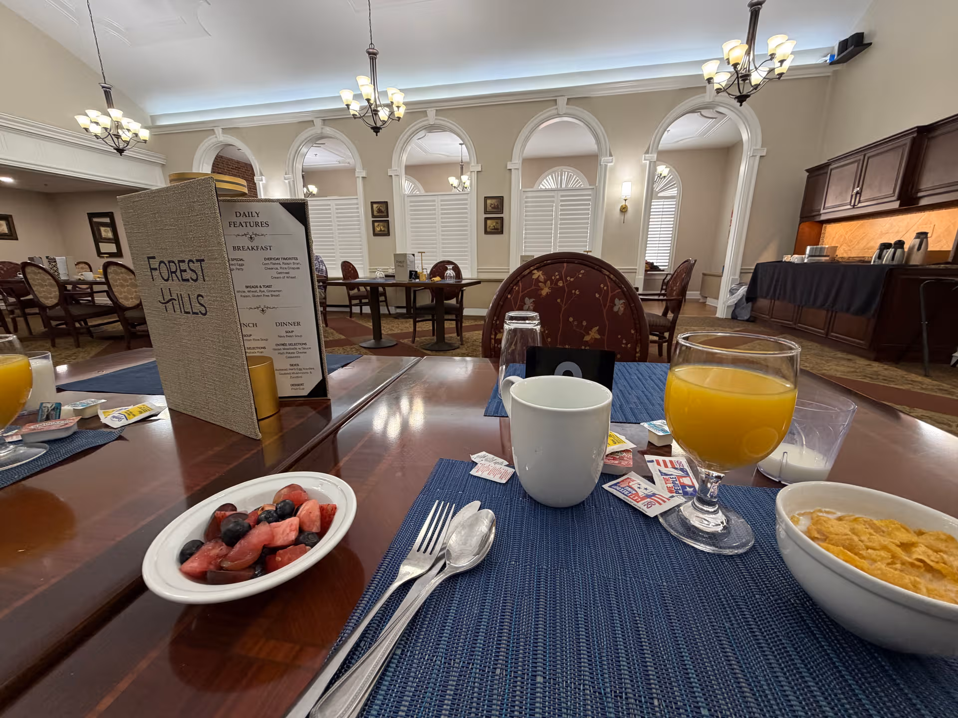 Forest Hills of DC dining room with tables, chairs, and a meal service setup.