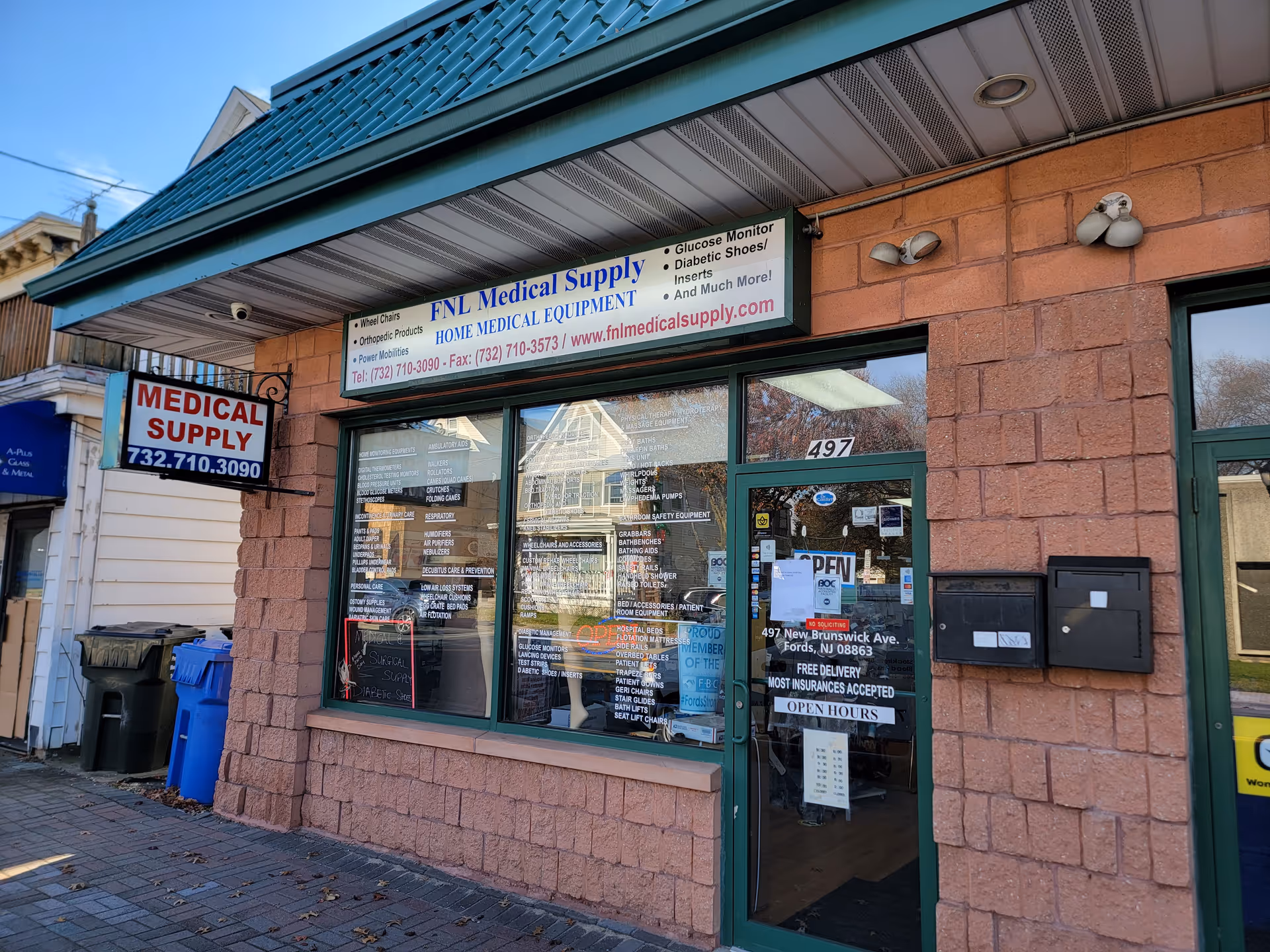 Brick storefront with FNL Medical Supply sign, glass windows, and a glass door.