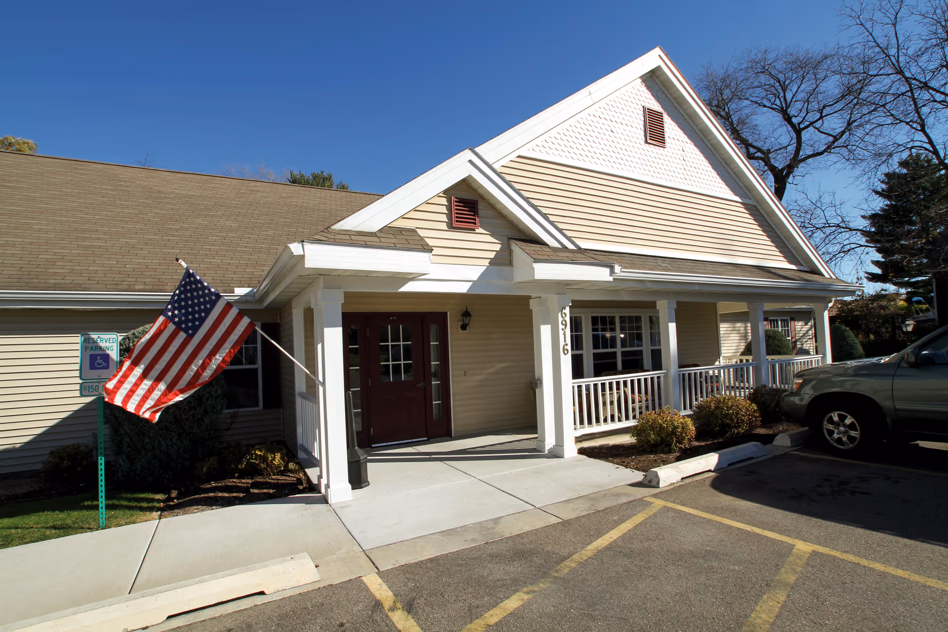 Brookdale Middleton Century Ave exterior with porch and American flag.