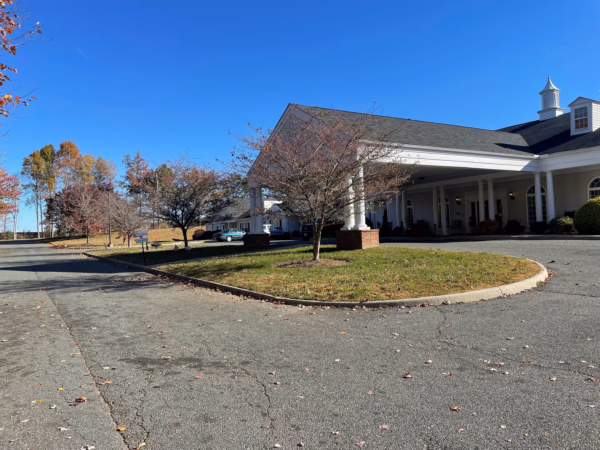Spring Oak at Louisa senior living facility exterior with circular driveway and trees