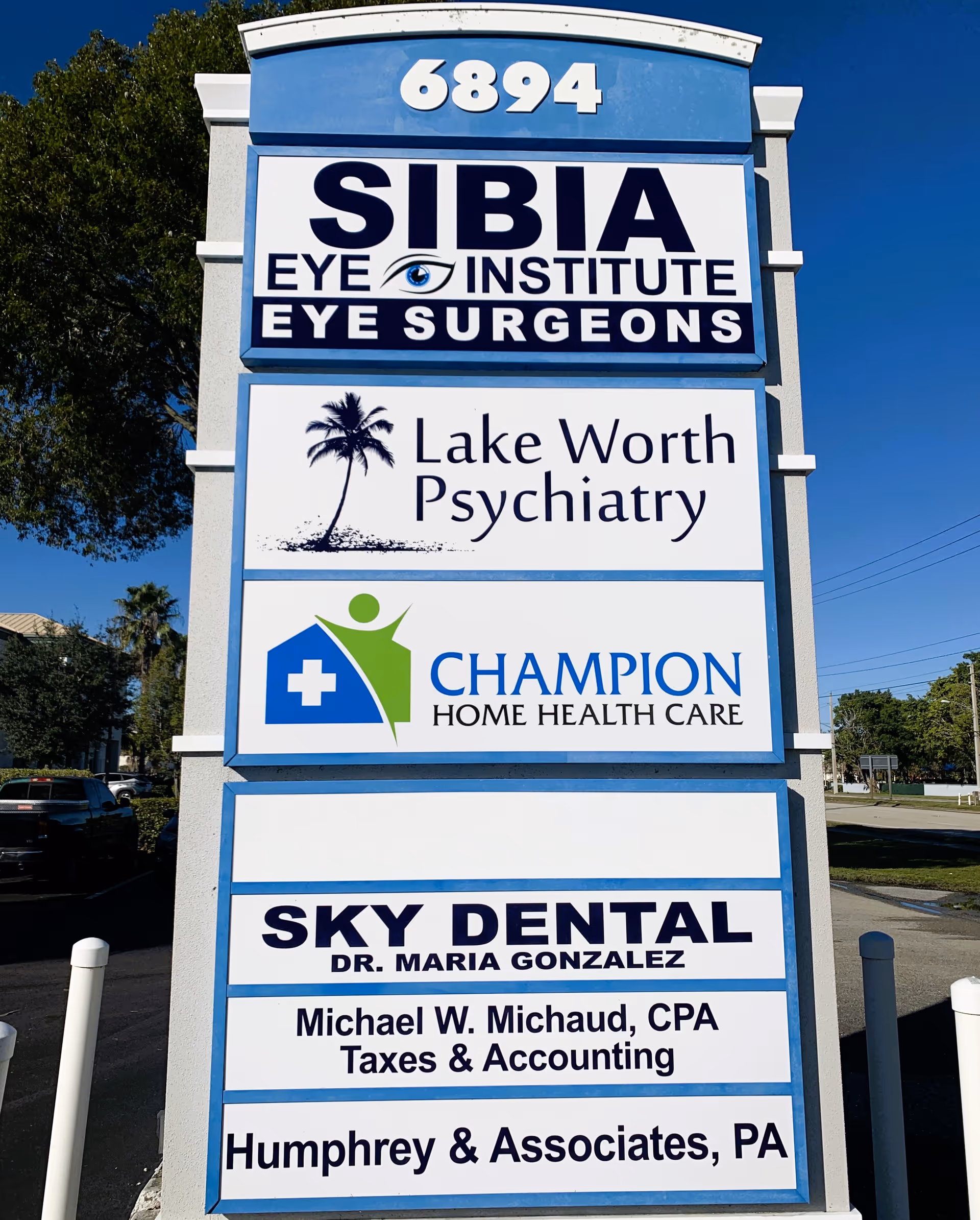 Outdoor sign tower listing Champion Home Health Care alongside other medical offices.