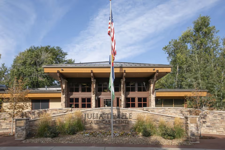 Exterior front view of Julia Temple Healthcare Center with flagpole and landscaping