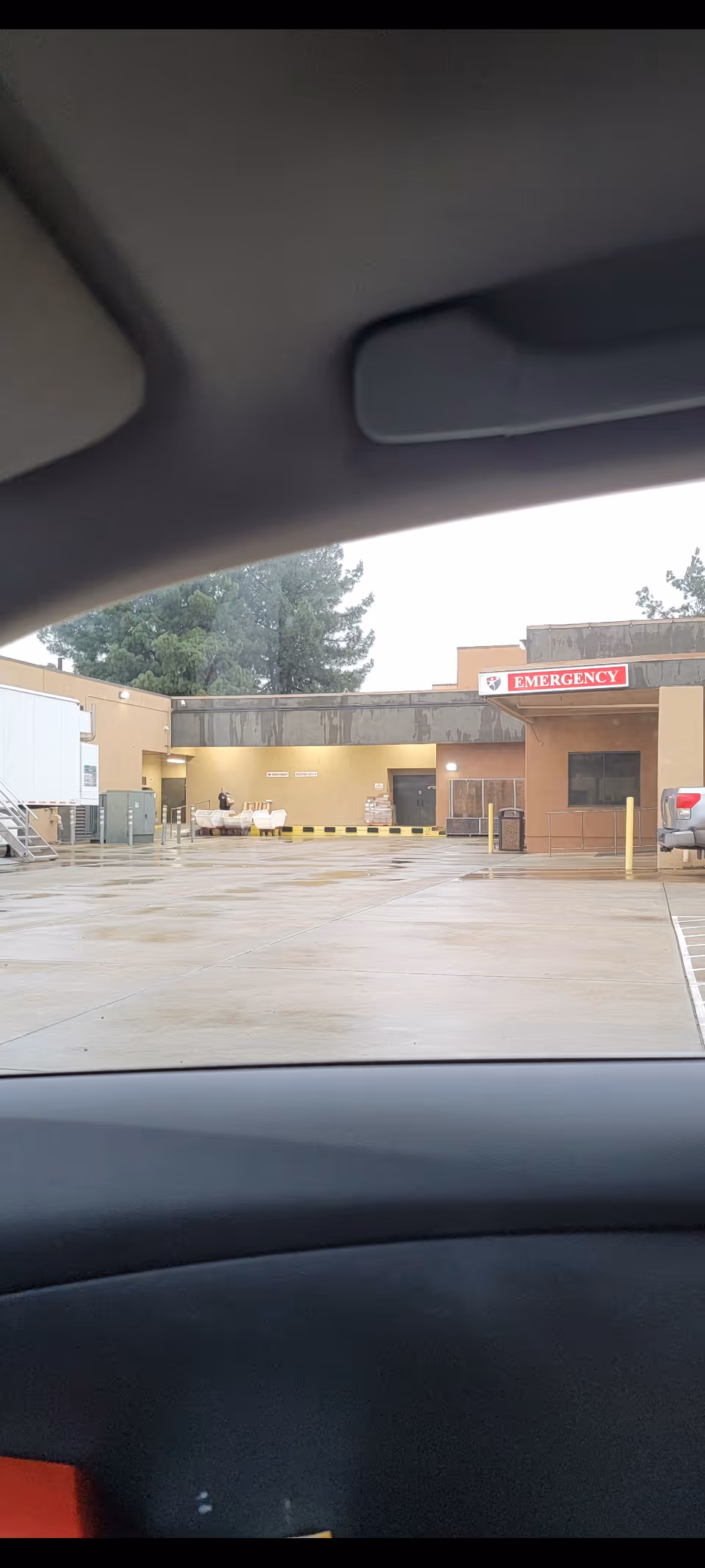 View of the Colusa Medical Center emergency entrance from inside a car.