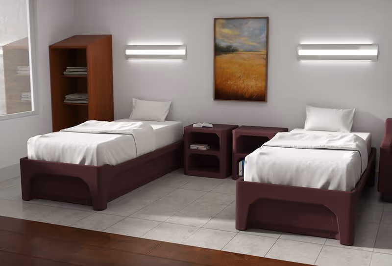 Two twin beds with maroon frames, white linens, and matching nightstands in a shared bedroom.