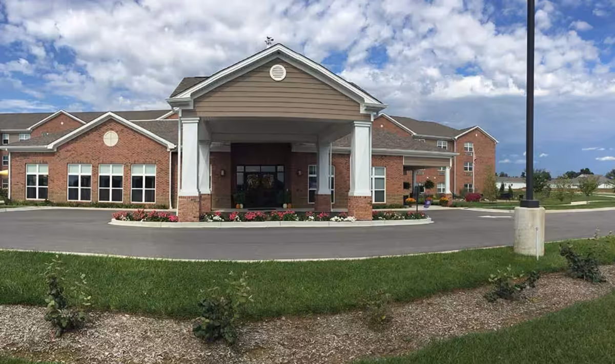 Exterior view of RobinBrooke Senior Living facility showcasing landscaped entrance.
