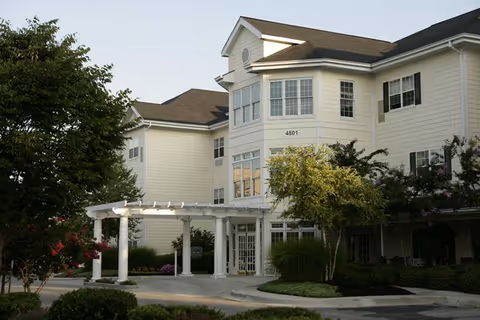 Exterior view of Hazel Findlay senior living building with entrance canopy and landscaping.
