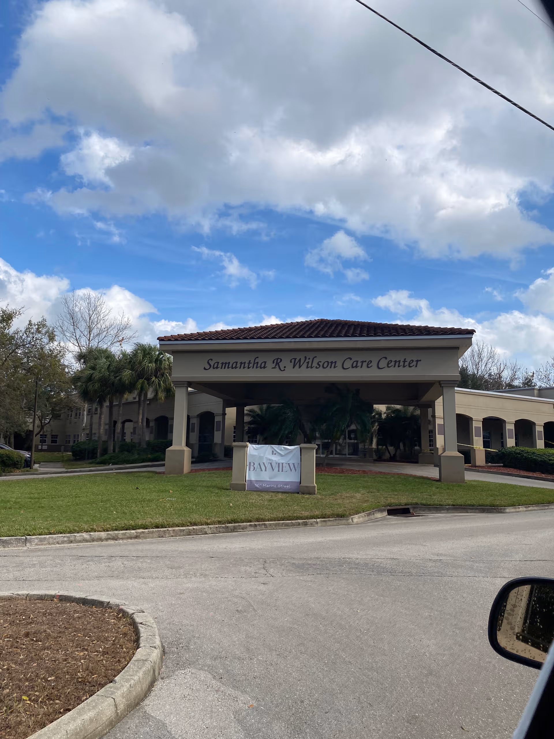 Exterior view of the Samantha R. Wilson Care Center entrance with BayView banner.