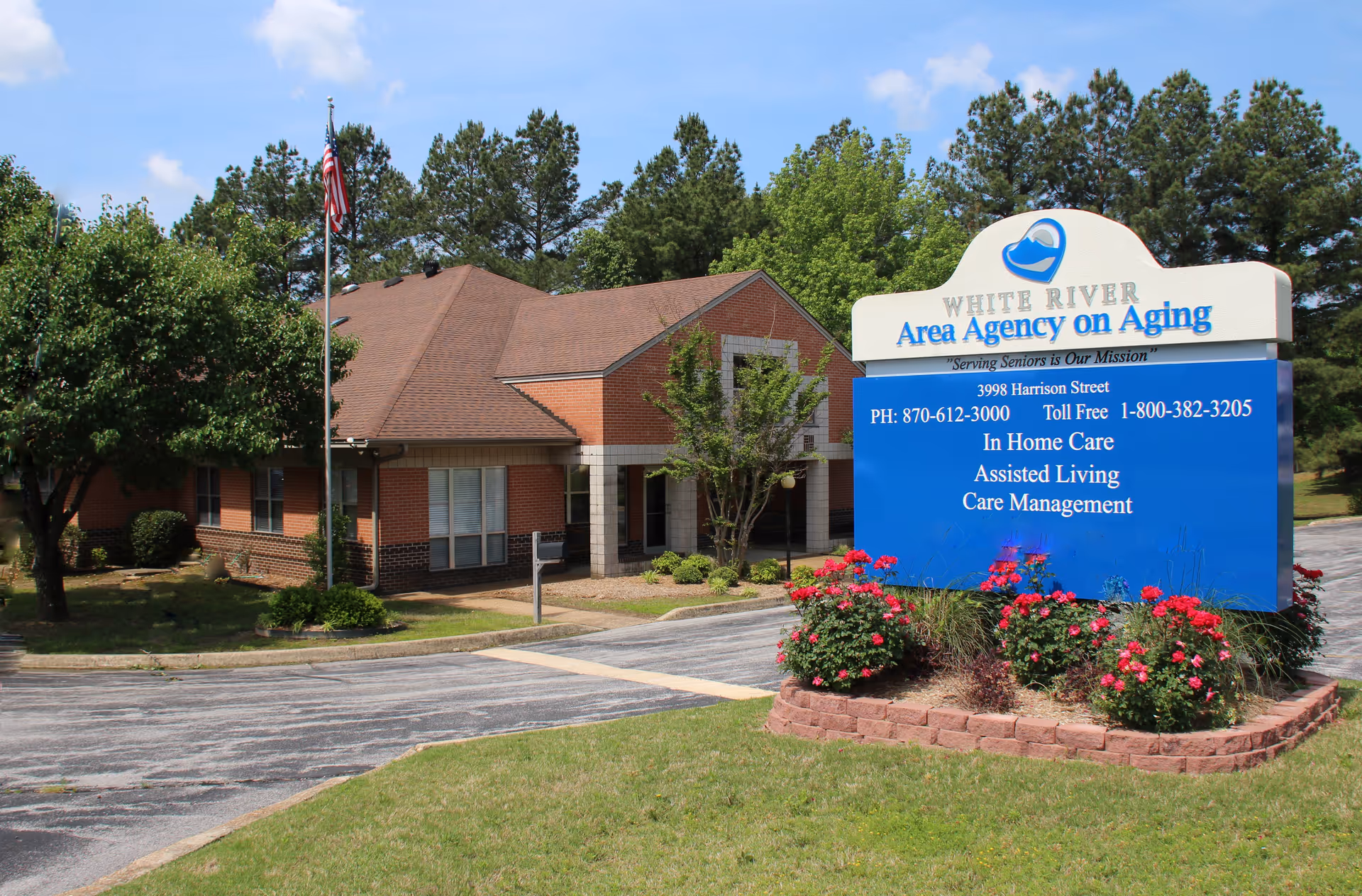 Exterior view of White River Area Agency on Aging building with sign and landscaping.