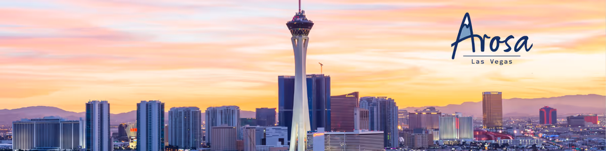 Sunset skyline of Las Vegas with Arosa Las Vegas branding.