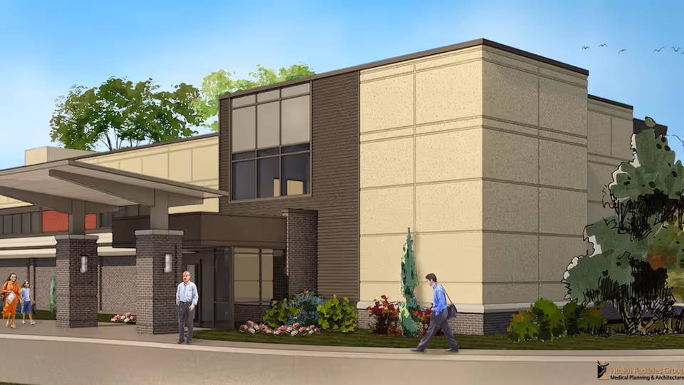 Exterior view of St. Rose Health Center with entrance and pedestrians.
