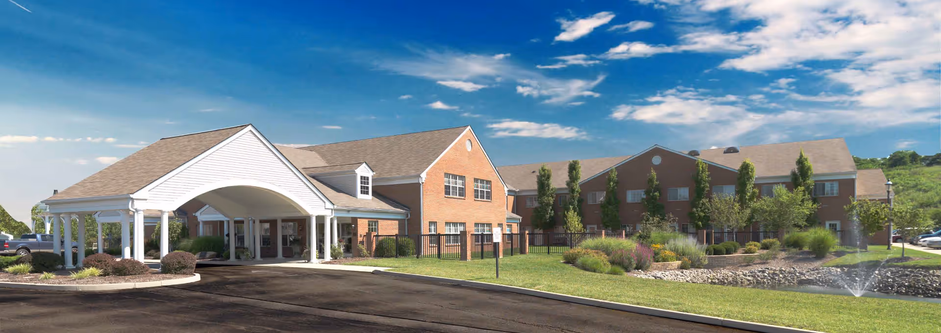 Exterior view of Villaspring of Erlanger: brick buildings, portico, and landscaped grounds.
