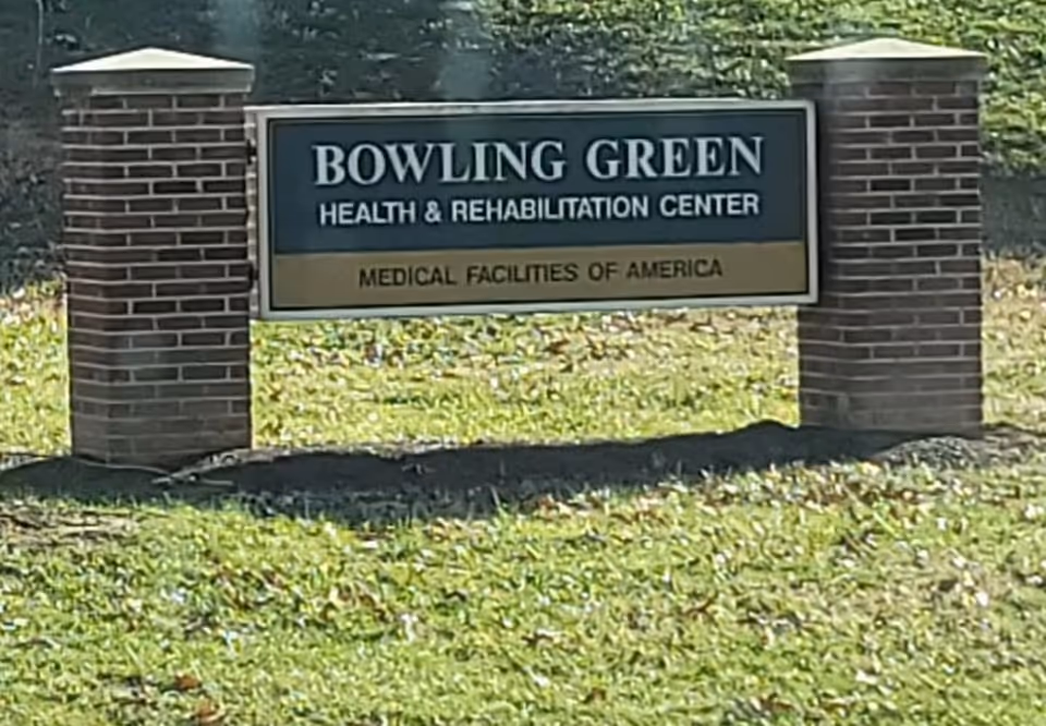 Brick entrance sign for Bowling Green Health & Rehabilitation Center set in grass