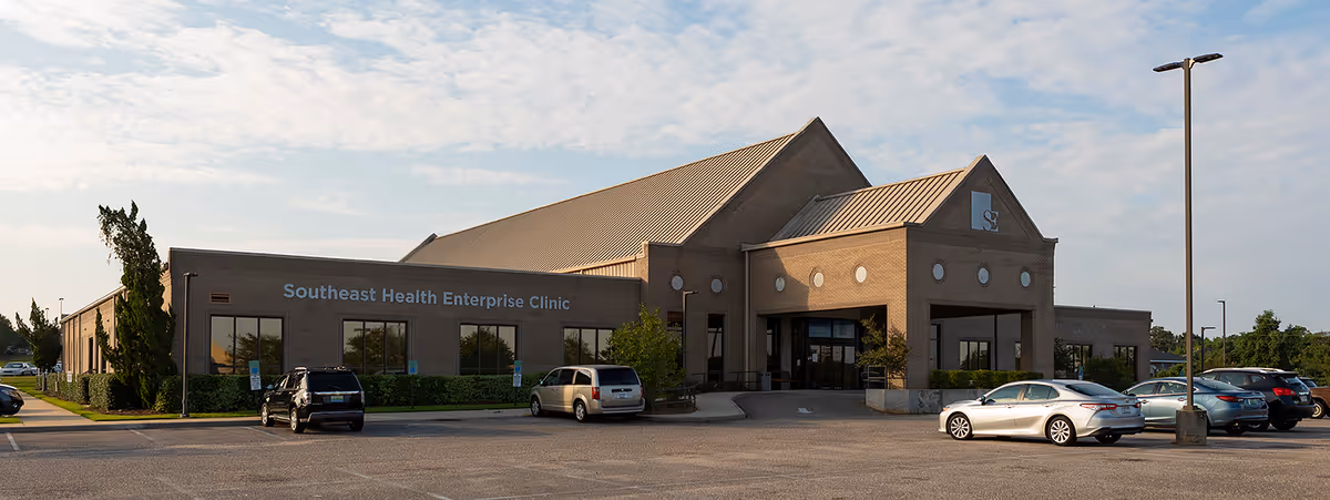 Exterior view of Southeast Health Enterprise Clinic with a parking lot