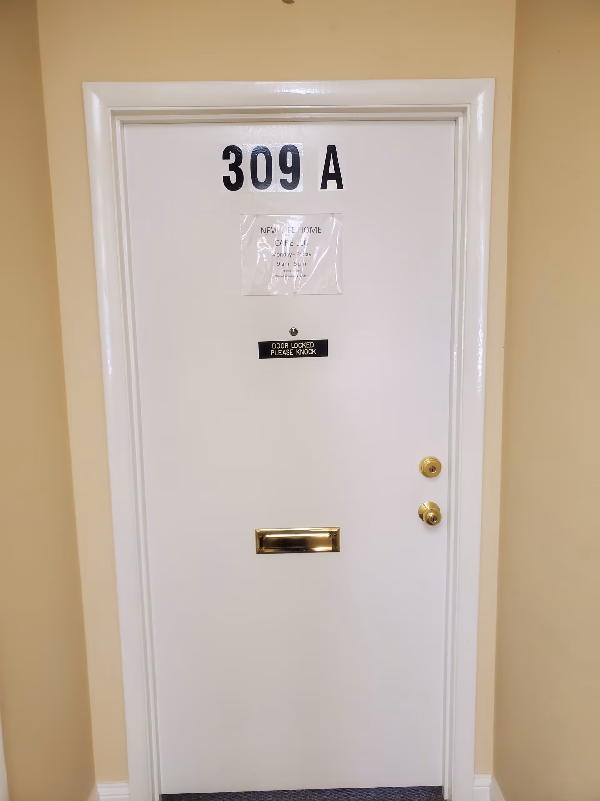 White interior door labeled 309 A with mail slot in beige hallway.