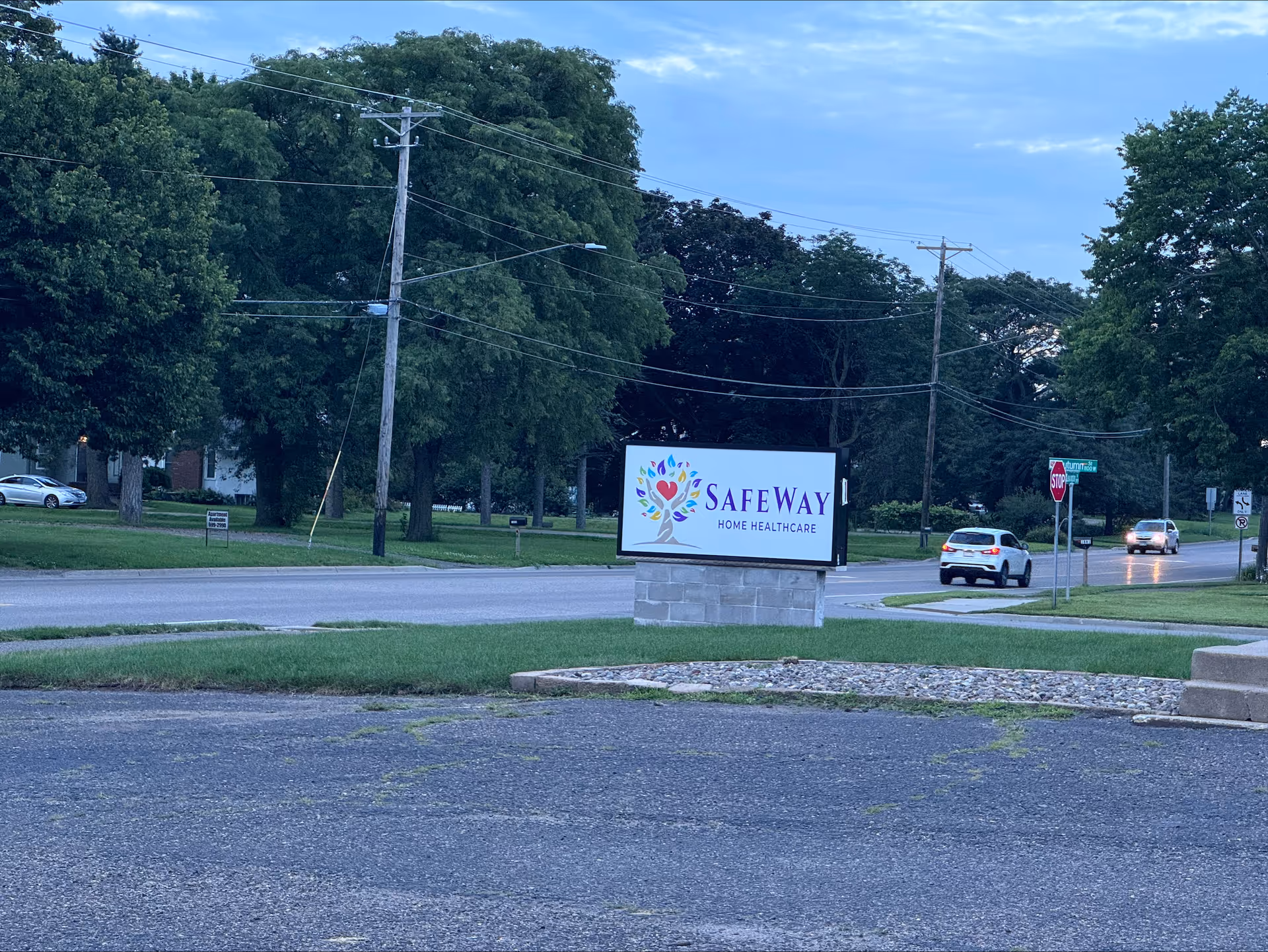 Outdoor view of a Safeway Home Healthcare sign along a road.