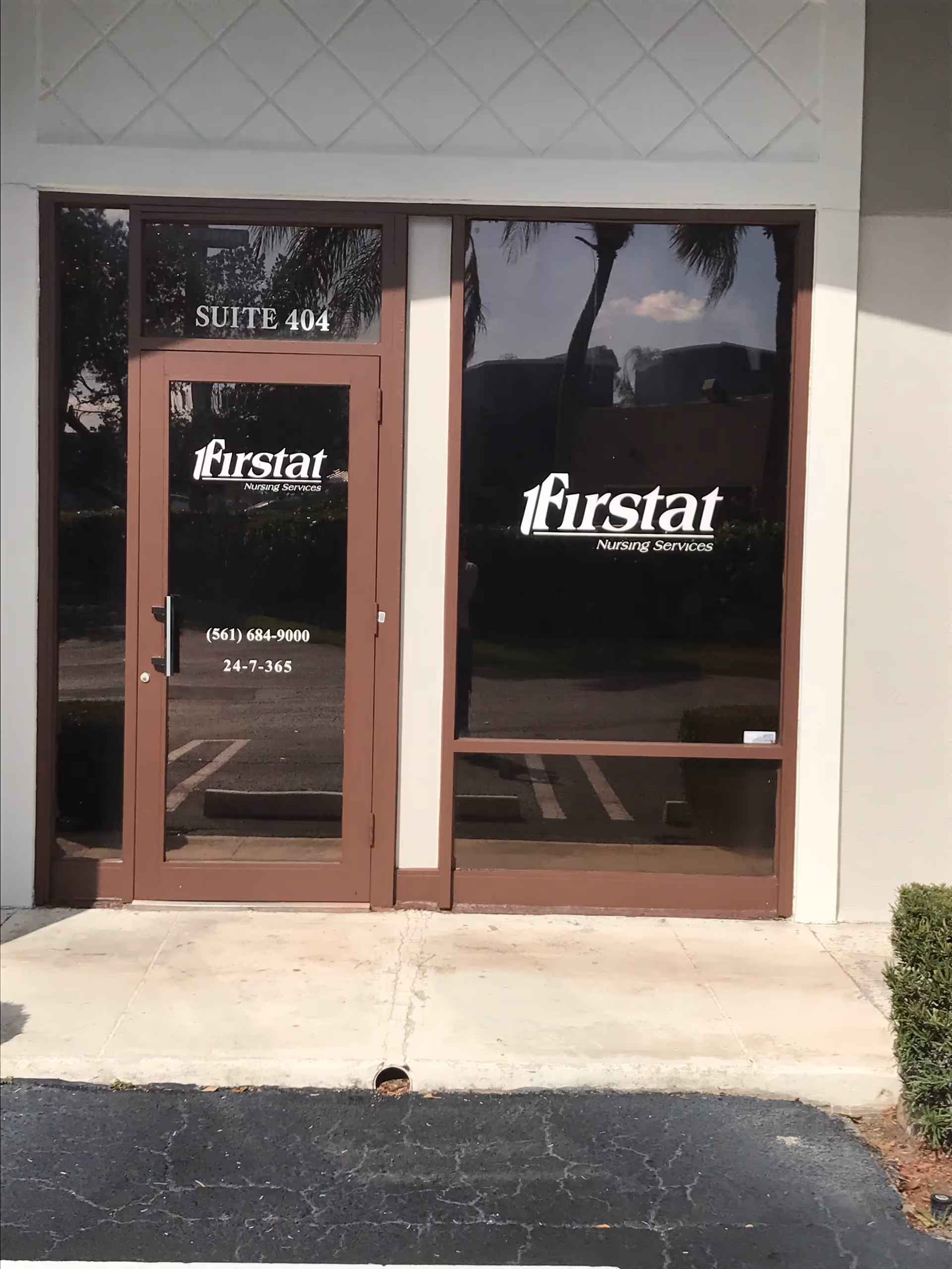 Entrance to Firstat Nursing Services with glass doors and suite 404.