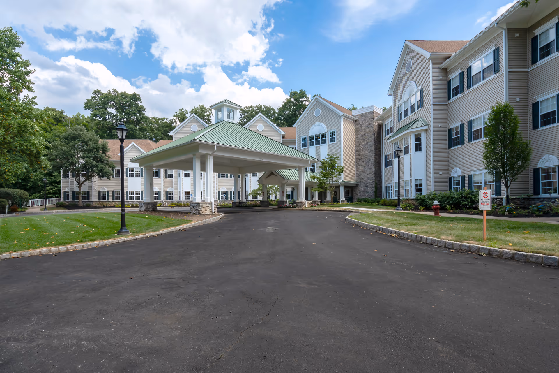 Exterior view of Brandywine Living Serenade at Princeton, featuring a covered entrance and multi-story buildings.