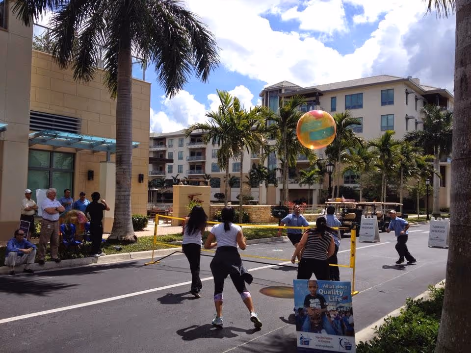 Outdoor scene at Moorings Park Home Health Agency with residents and staff near entrance.