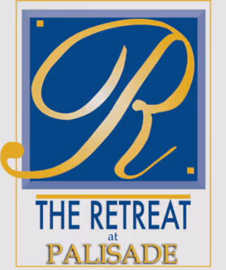 Signage for The Retreat at Palisade featuring a gold R on blue background.