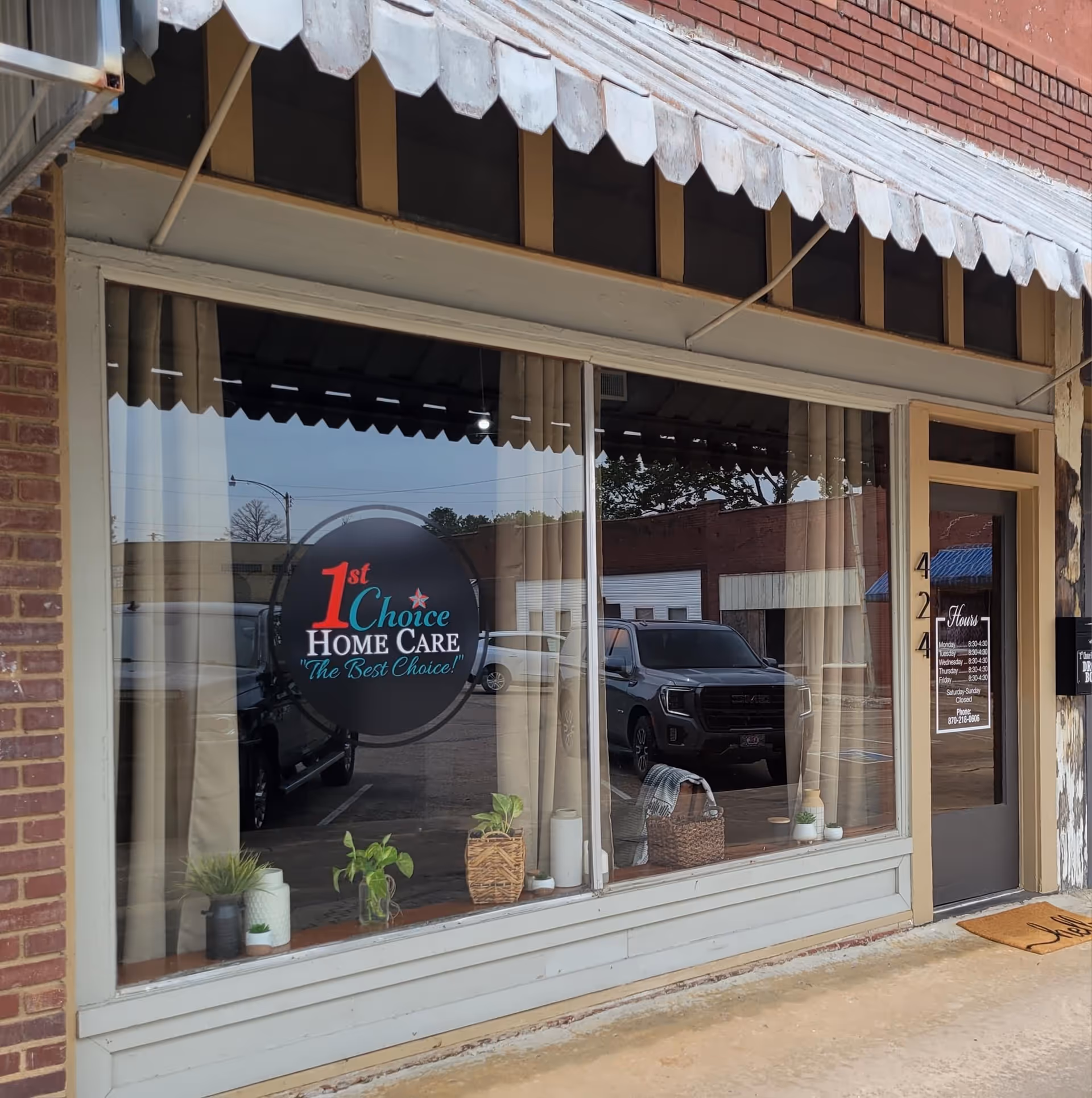 Storefront with large window display showing 1st Choice Home Care logo and entrance.