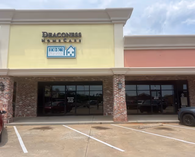 Front view of Deaconess HomeCare building with glass doors and brick columns.