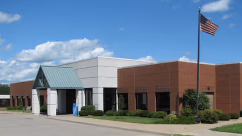 Exterior view of Van Buren County Hospital entrance with a canopy and flagpole.