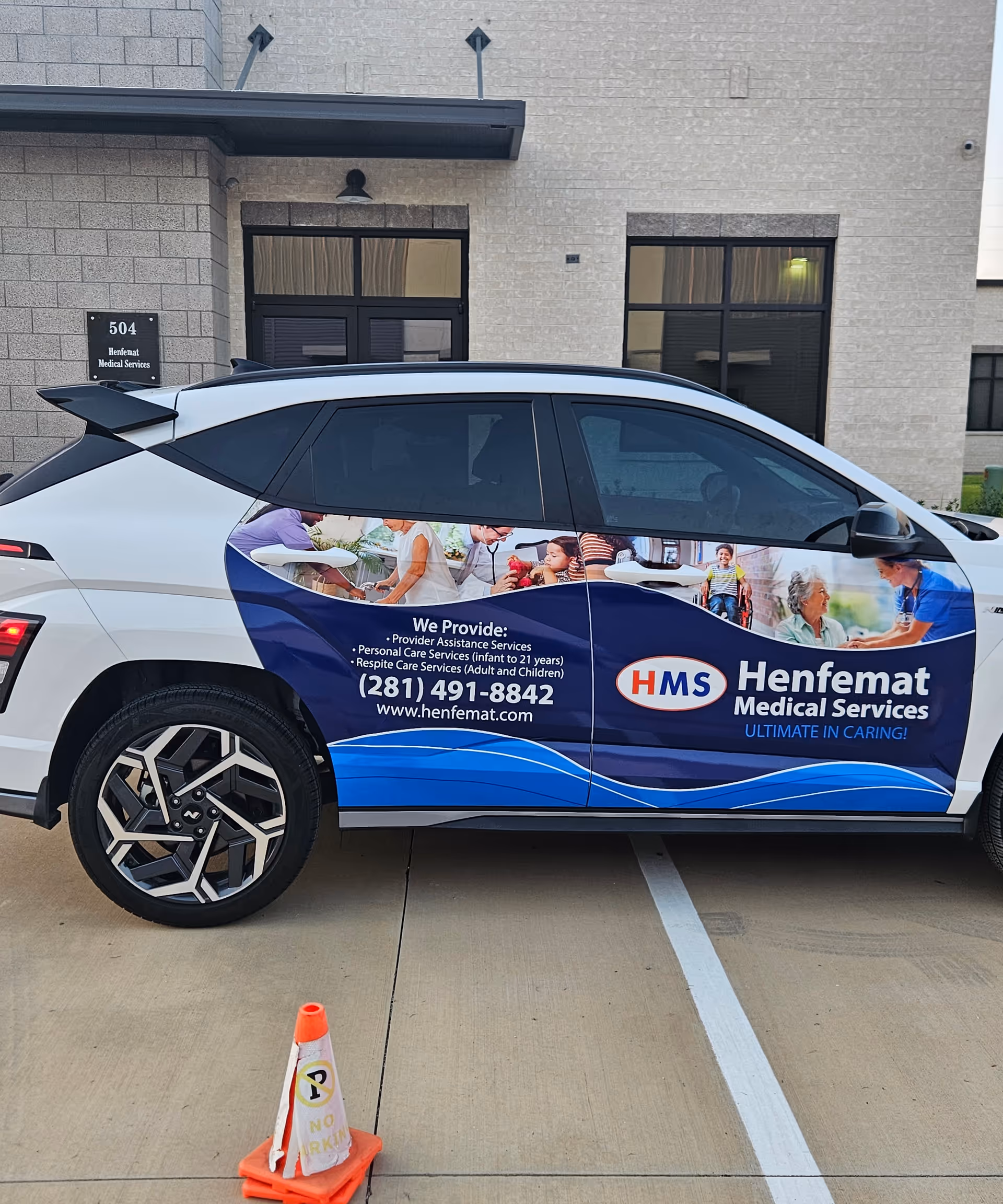 Exterior view of Henfemat Medical Services facility with a branded service vehicle parked outside.