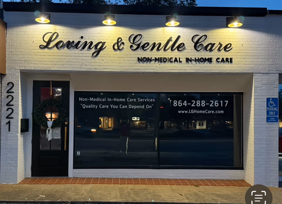 Facade of Loving & Gentle Care storefront with large sign and wreath on the door.
