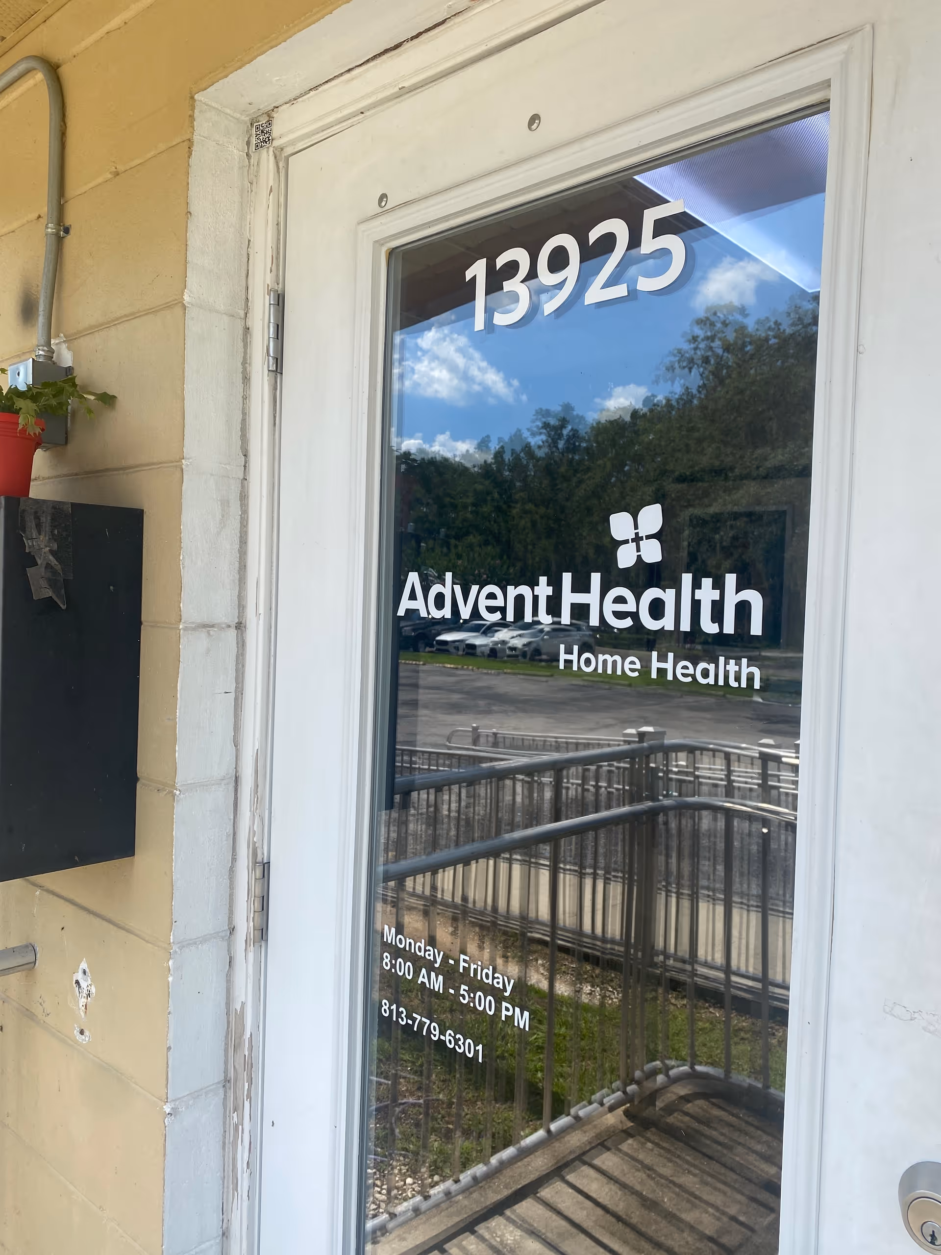Glass door displays 13925 with AdventHealth Home Health logo at exterior entrance.