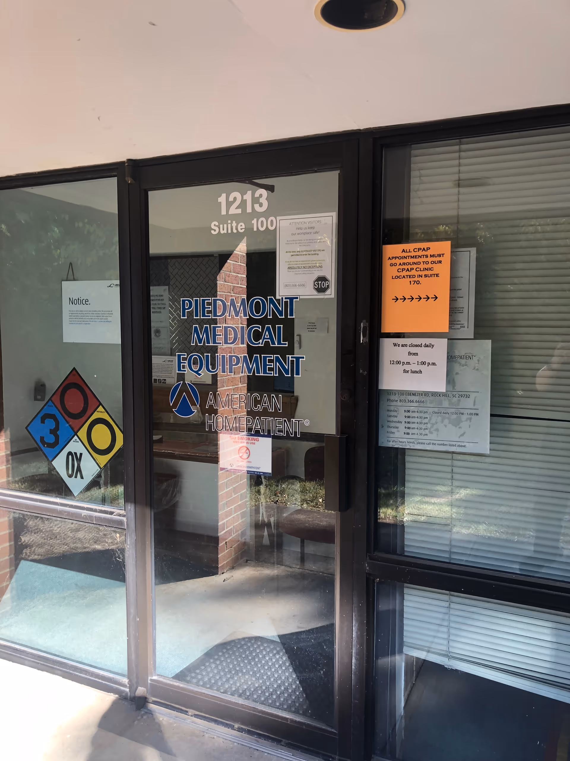 Entrance of Piedmont Medical Equipment with glass doors and logo signage.