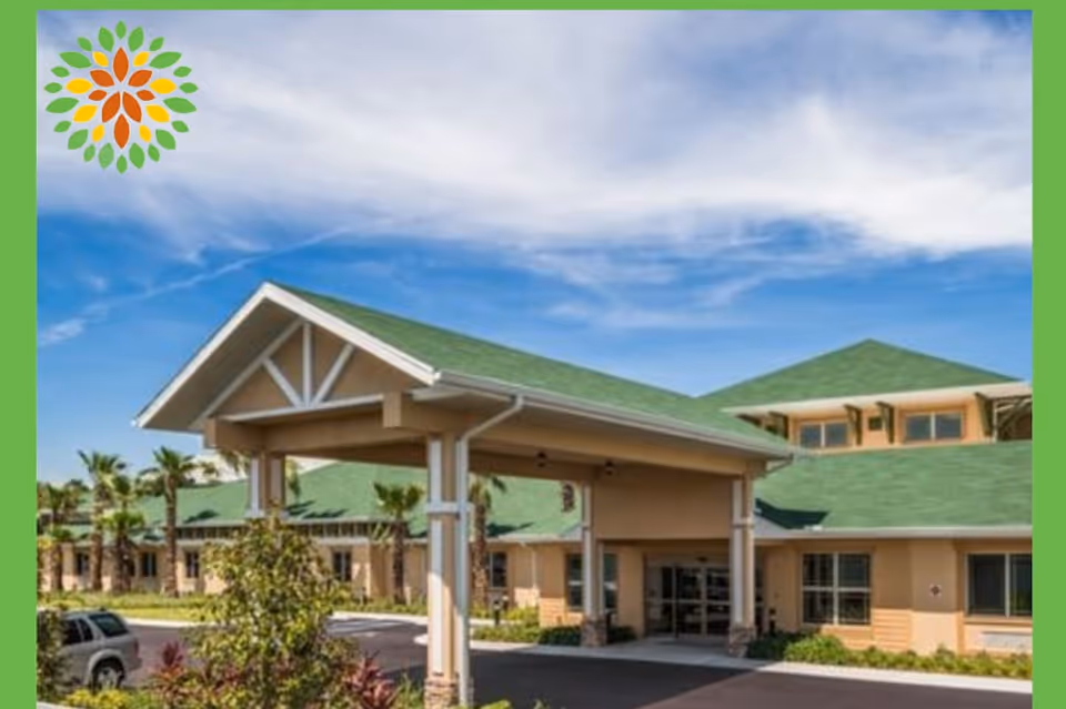 Senior living facility exterior with green roof and covered entrance canopy