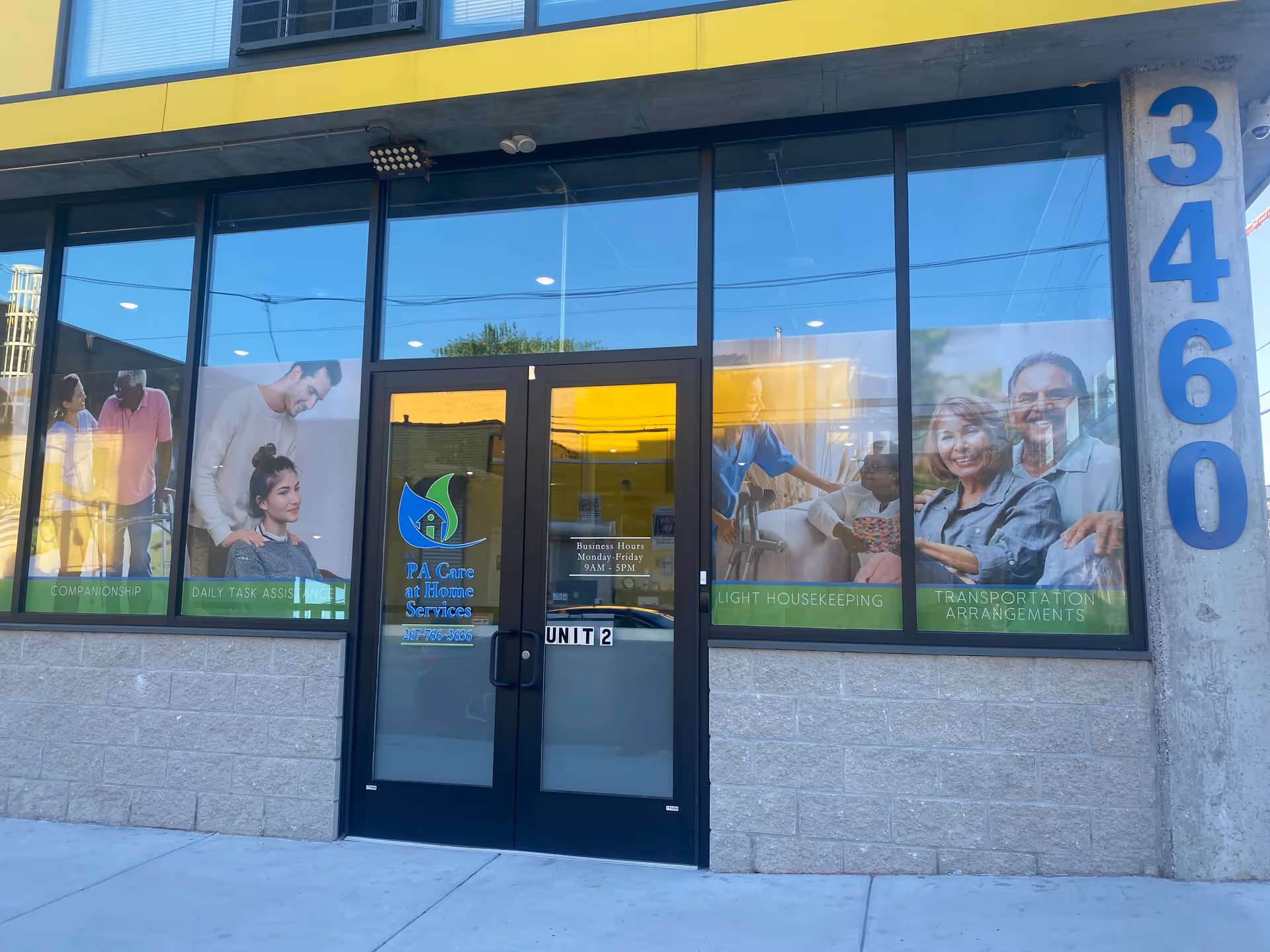 Front exterior of PA Care at Home Services storefront with large windows and door.