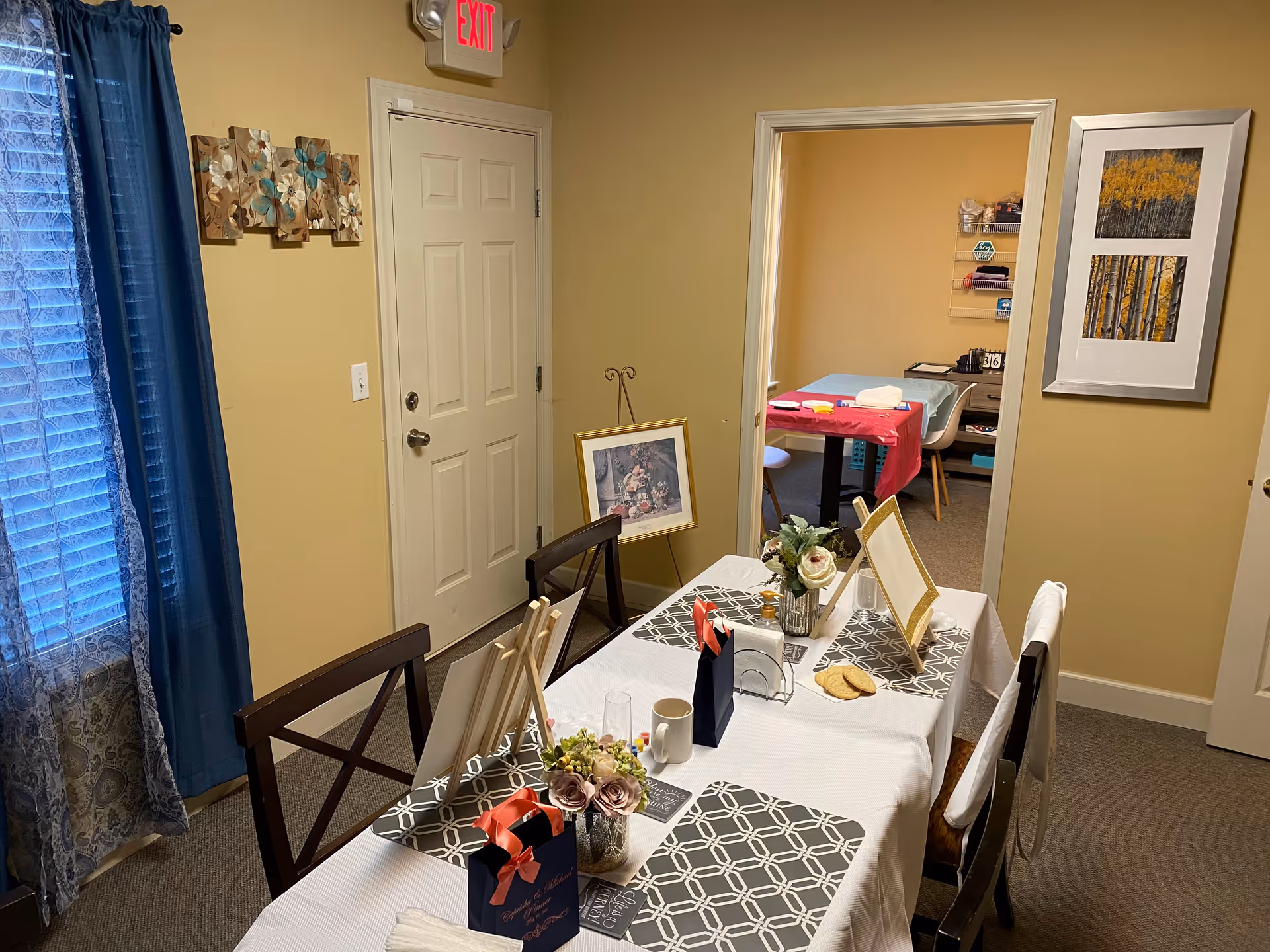 A dining table set for a meal in a cozy senior living dining room.