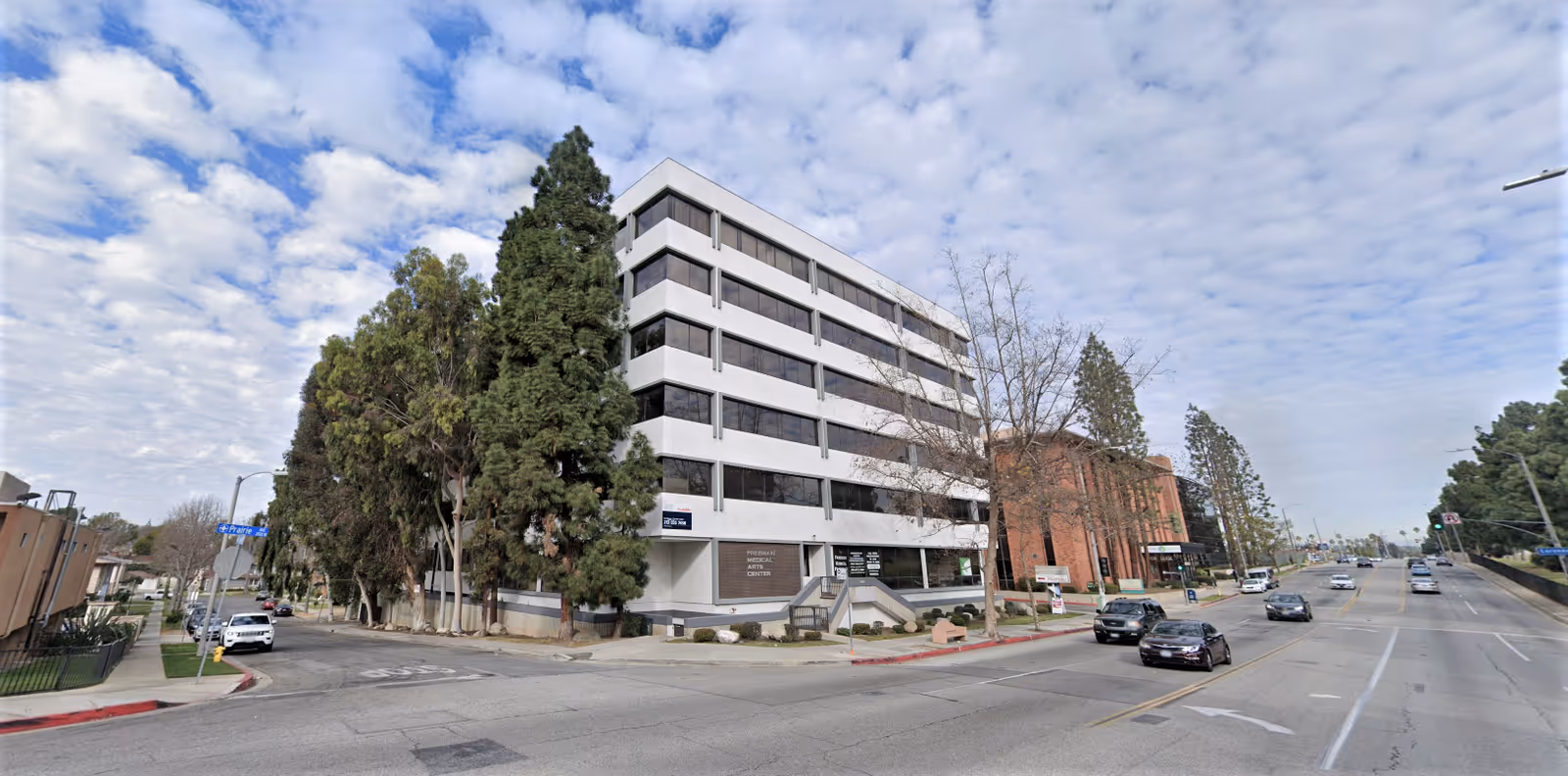 Exterior view of Western States Home Health Care Agency building along a tree-lined street.