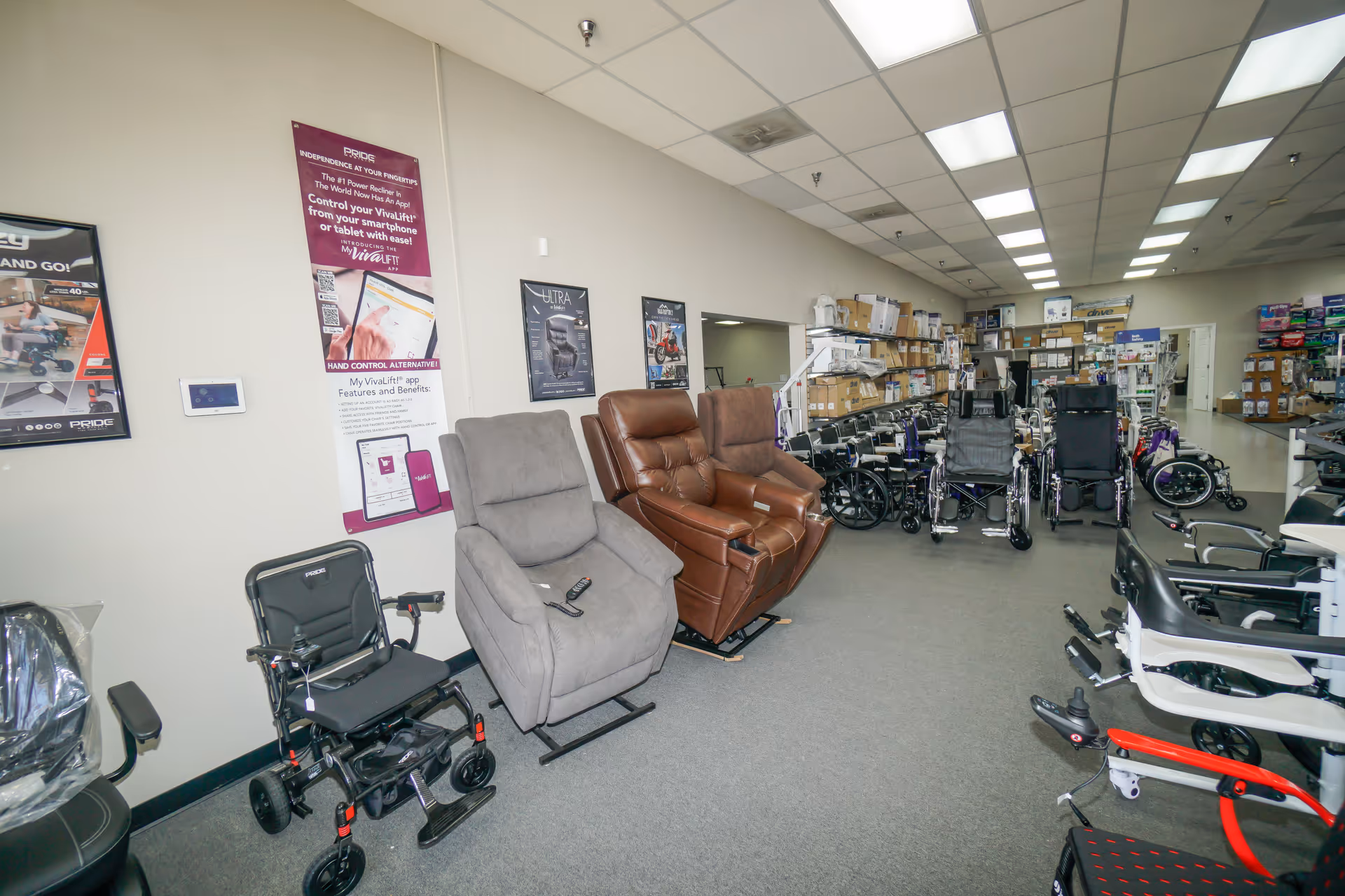 Spacious indoor showroom displaying wheelchairs, recliners, and mobility devices along shelves.