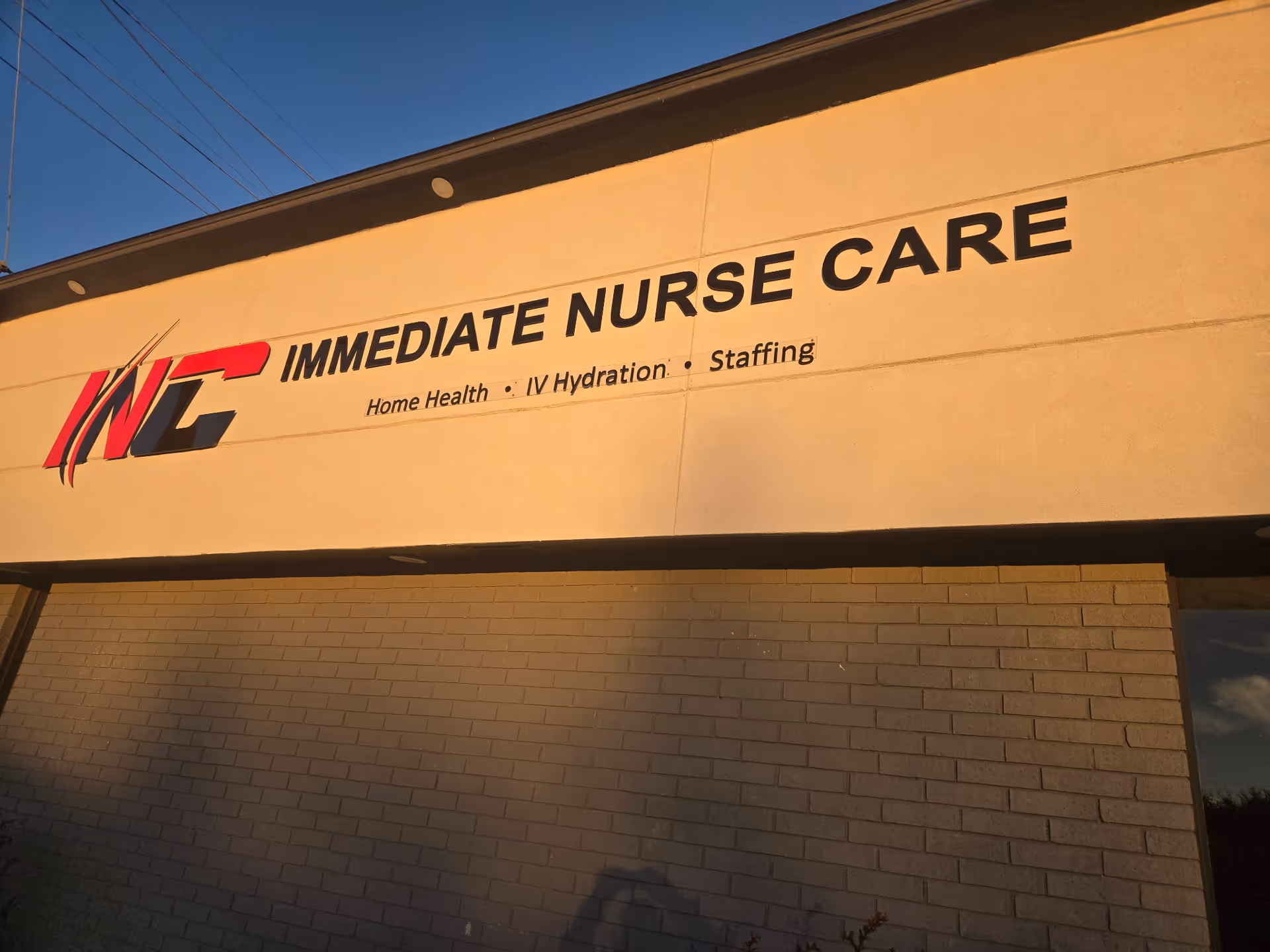 Exterior view of a building with an Immediate Nurse Care sign