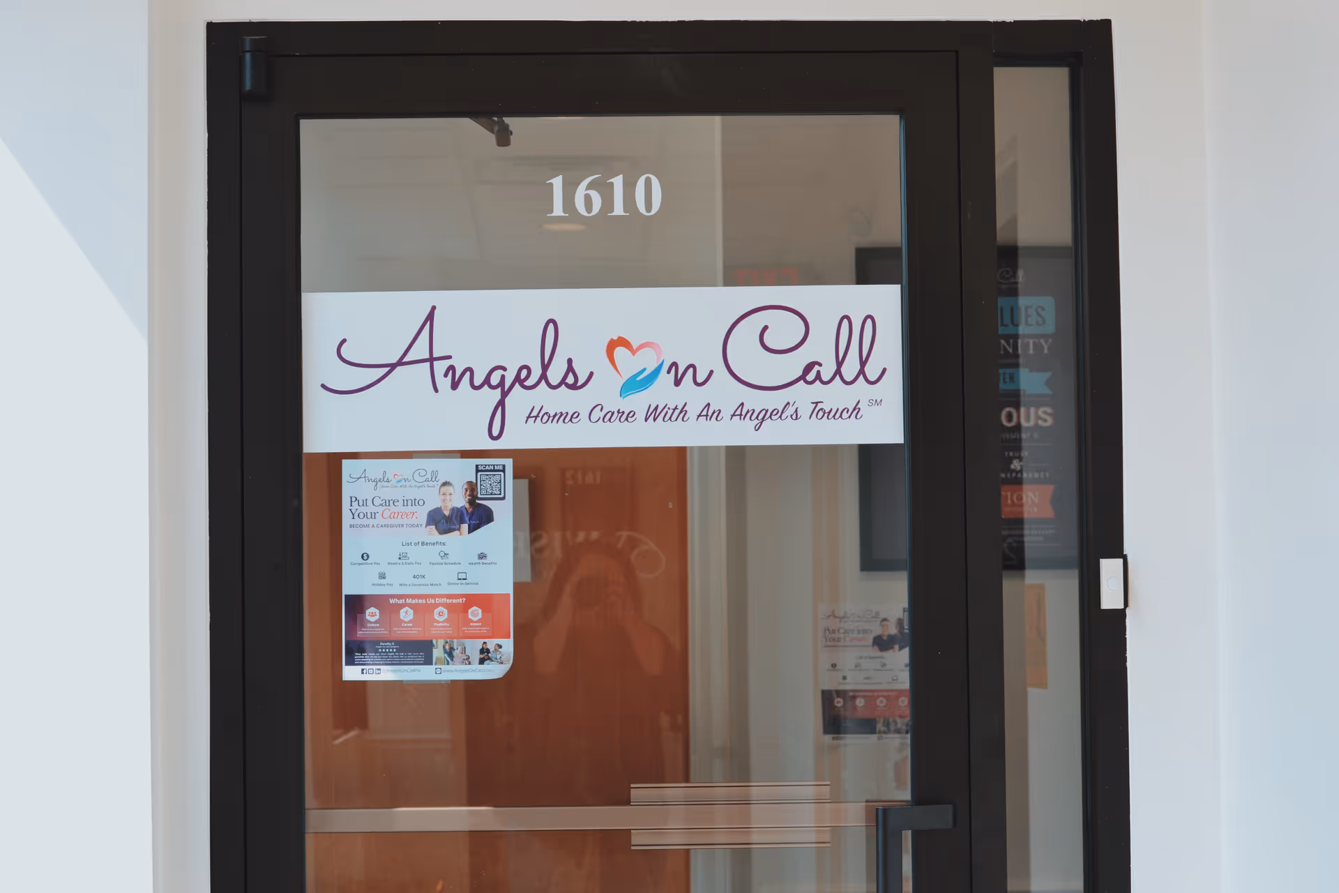 Glass door entrance with Angels On Call sign and the number 1610.