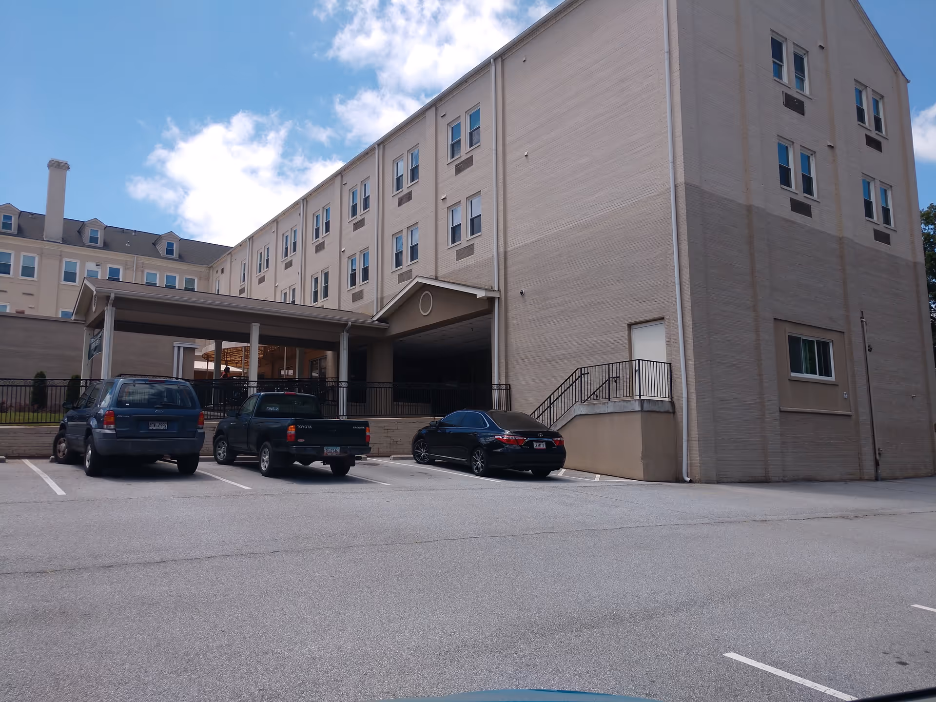 Exterior view of Pruitthealth Decatur building with parked cars in front.