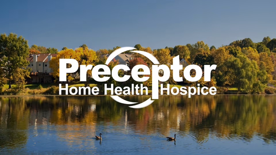 A lakeside facility campus with autumn trees and a large Preceptor logo overlay.