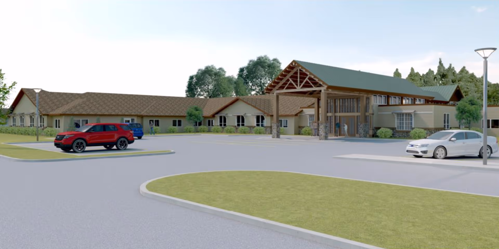 Front exterior of a one-story senior living facility with a covered entrance, parking lot, and a few parked cars.