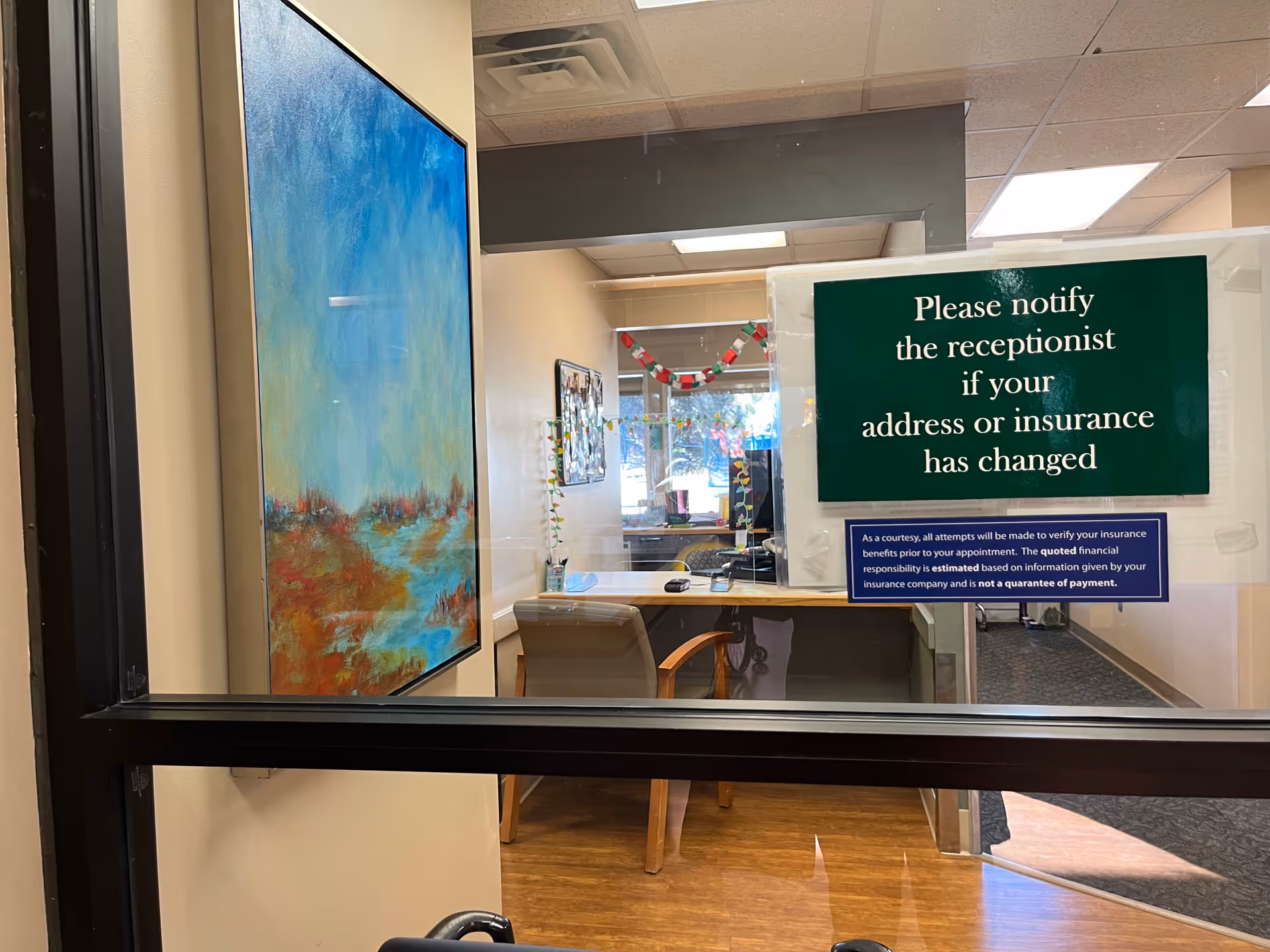 Reception area inside Care Partners Outpatient Services, featuring a desk and signage.