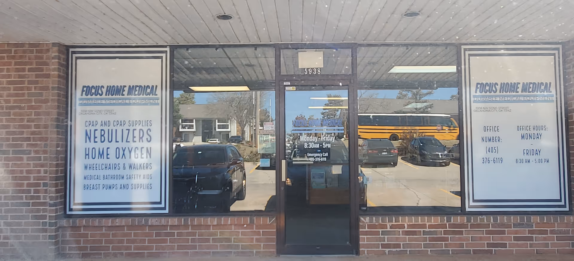 Storefront with glass doors, windows, Focus Home Medical signage, and a yellow school bus outside