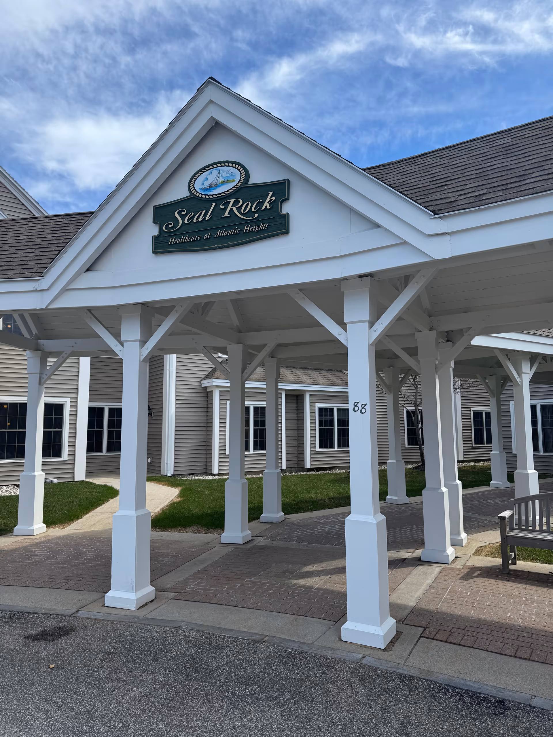 Front entrance of Inn at Atlantic Heights with white pillars and covered walkway.